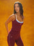 Woman wearing a maroon athletic outfit with white accents against an orange background