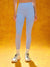 Person wearing light blue leggings on a yellow background