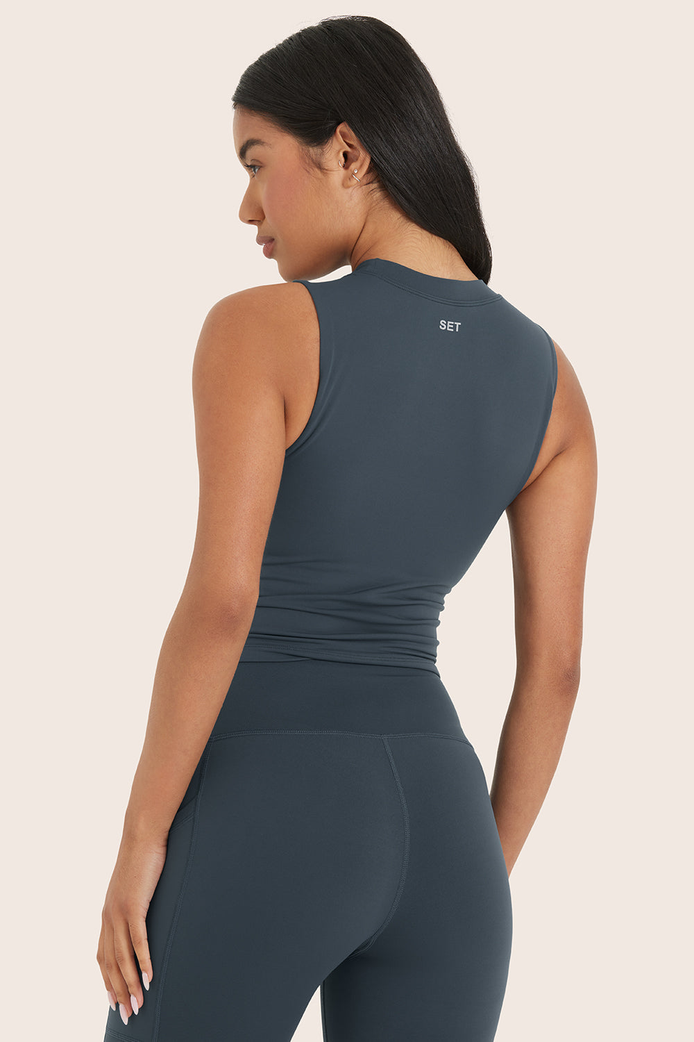 MODEL WEARS AIRLUXE™ BREATHE LEAN BRA IN COMPASS 