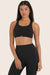 MODEL WEARS BREATHE FLEX BRA IN ONYX <model-info>Yarelis wears a size S and is 5'9", 25" waist, 32B bra.</model-info>