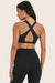 MODEL WEARS BREATHE FLEX BRA IN ONYX 