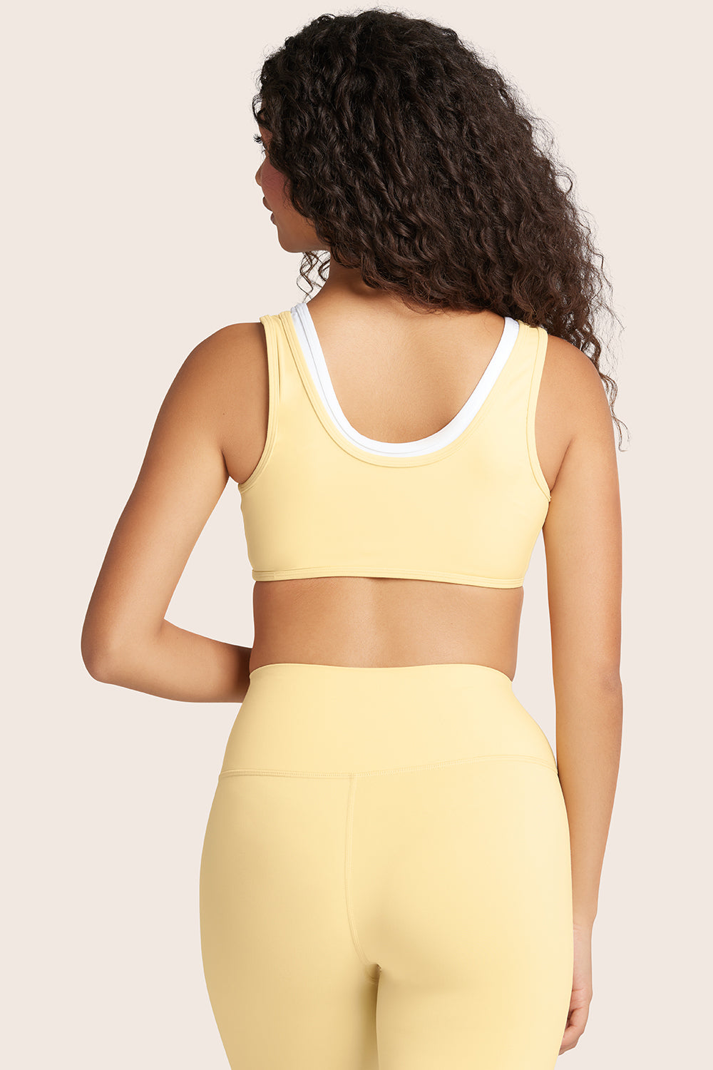 MODEL WEARS AIRLUXE™ BREATHE LAYER SCOOP BRA IN BUTTER 