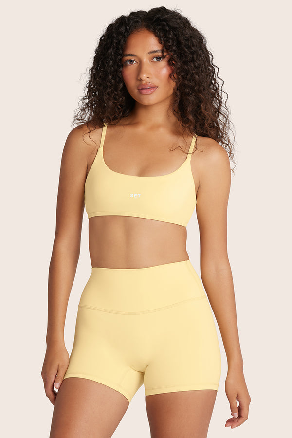 MODEL WEARS AIRLUXE™ BREATHE BASE BRA IN BUTTER 