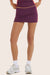 Model wears FORMCLOUD® CLOUD CONTRAST MINI SKIRT in ACAI <model-info>- Reese wears a size XS and is 5’8", 23.5" waist, 31" bust.</model-info>