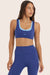 Model wears BREATHE LAYER SCOOP BRA in BETTA 