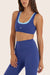 Model wears BREATHE LAYER SCOOP BRA in BETTA 