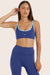 Model wears BREATHE CONTRAST MOVE BRA in BETTA <model-info>Reese wears a size XS and is 5’8", 23.5" waist, 31" bust.</model-info>