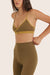 Model wears BREATHE PIPELINE BRA in OTTER 