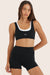 Model wears BREATHE LAYER SCOOP BRA in ORCA 