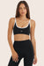 Model wears BREATHE CONTRAST MOVE BRA in ORCA <model-info>Reese wears a size XS and is 5’8", 23.5" waist, 31" bust.</model-info>