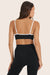 Model wears BREATHE CONTRAST MOVE BRA in ORCA 