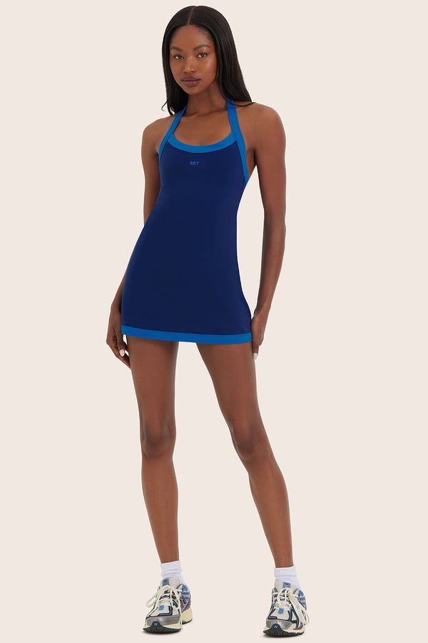 Model wears SPORTBODY® SPORTY HALTER DRESS in GECKO 