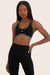 Model wears SPORTBODY® SPORTY STITCH BRA in ORCA 