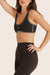 Model wears SPORTBODY® SPORTY STITCH BRA in Birthday ESPRESSO 