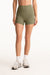 Person wearing olive green shorts on a white background <model-info>Jasmine wears a size S and is 5’8”, 25" waist, 36” bust.</model-info>