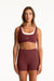 Woman wearing a maroon sports bra and shorts set with 'SET' branding on a white background <model-info>Presley wears a size S and is 5’6”, 26” waist, 33” bust.</model-info>