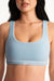 Light blue sports bra worn by a person on a white background