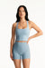 Woman wearing a light blue athletic outfit on a white background <model-info>Jasmine wears a size S and is 5’8”, 25" waist, 36” bust.</model-info>