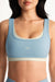 Light blue sports bra with 'SET' logo on a white background