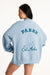 Light blue jacket with 'Parke Set Active' text and sailboat graphic on a white background
