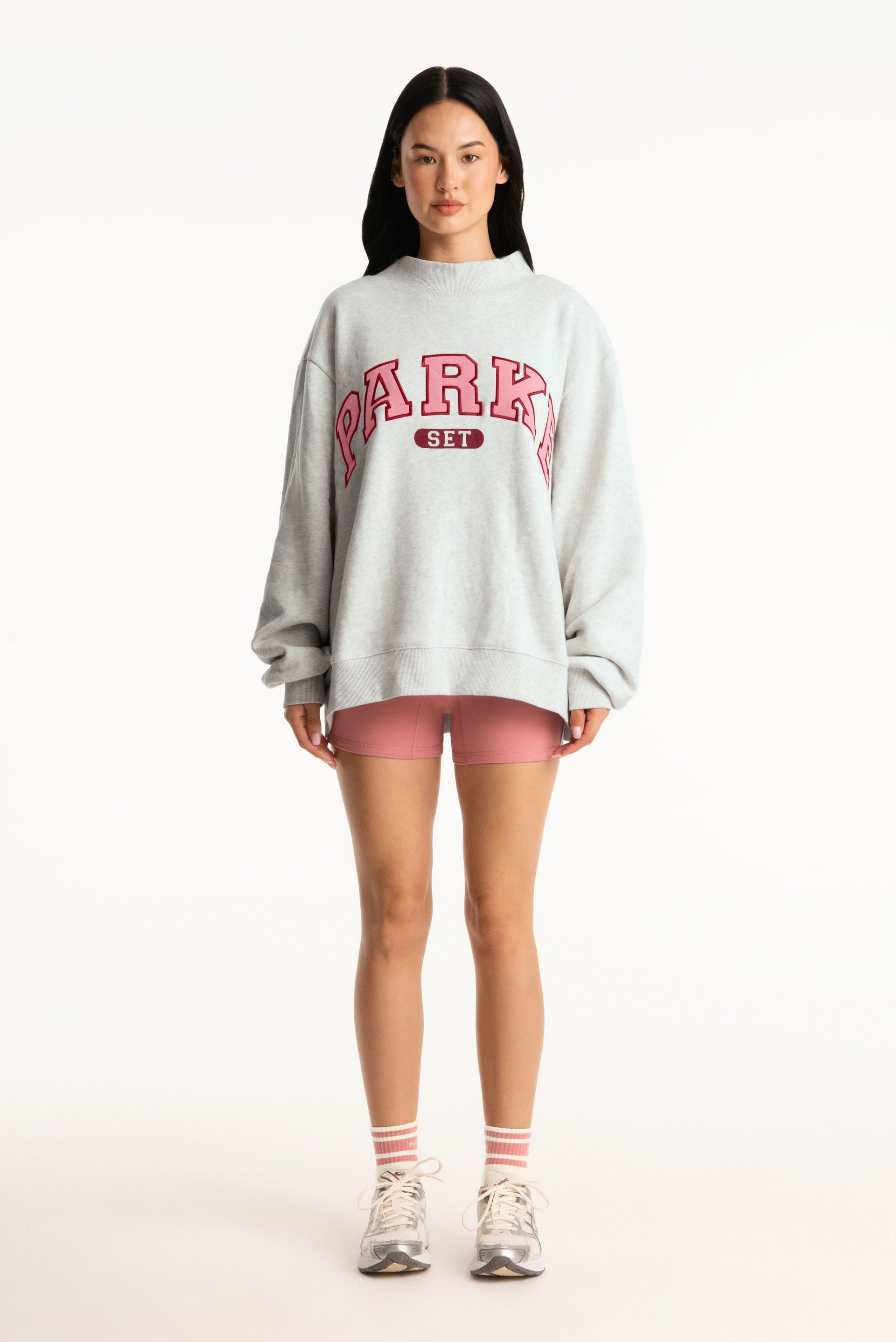 Person wearing a gray sweatshirt with 'PARKE' text on a white background