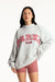 Woman wearing a gray sweatshirt with 'PARK' printed in red on a white background <model-info>Jasmine wears a size L/XL and is 5’8”, 25" waist, 36” bust.</model-info>