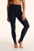 Person wearing black leggings on a plain background <model-info>Presley wears a size S and is 5’6”, 26” waist, 33” bust.</model-info>