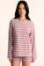 Woman wearing a striped long-sleeve top and shorts on a beige background <model-info>Jasmine wears a size S and is 5’8”, 25" waist, 36” bust.</model-info>