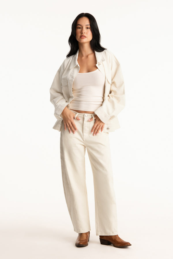 Woman wearing a white outfit on a white background