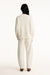 Person wearing a white outfit on a white background