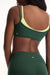 Green sports bra and leggings set on a white background