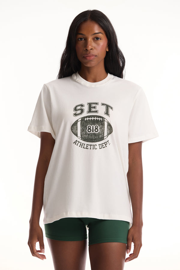 Woman wearing a white t-shirt with 'SET' and '818' graphic design on a white background 