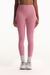 Person wearing pink leggings on a white background <model-info>Autumn wears a size S and is 5’7½”, 25” waist, 32” bust.</model-info>