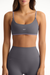 Gray sports bra and leggings set with 'SET' branding on a white background