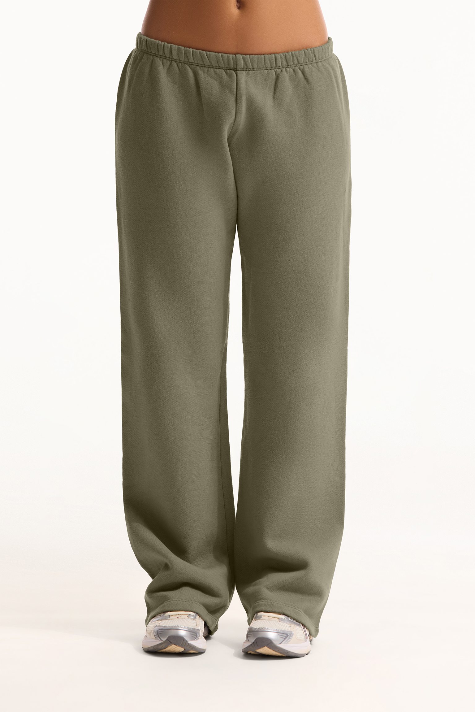 Green sweatpants worn by a person on a white background <model-info>Sophie wears a size S and is 5’9½”, 23” waist, 34CD bust.</model-info>
