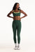 Woman wearing a green sports bra and leggings set on a white background