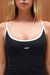 Black tank top with white straps and 'SET' logo on a plain background