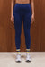 Person wearing blue leggings with yellow stripes on a wooden background <model-info>Grace wears a size XS and is 5'8", 25" waist, 32" bust.</model-info>