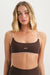 Woman wearing a brown sports bra with 'SET' branding on a white background <model-info>Grace wears a size XS and is 5'8", 25" waist, 32" bust.</model-info>