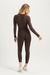 Person wearing a brown bodysuit on a white background