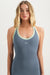 Woman wearing a gray tank top with green trim on a white background <model-info>Grace wears a size XS and is 5'8", 25" waist, 32" bust.</model-info>