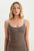 Woman wearing a brown tank top with 'SET' branding on a white background <model-info>Grace wears a size XS and is 5'8", 25" waist, 32" bust.</model-info>