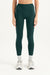 Person wearing dark green leggings on a white background <model-info>Casey wears a size S and is 5’9”, 24” waist, 32B bust.</model-info>