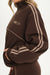 Brown tracksuit with white stripes on a plain background