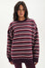 Woman wearing a striped sweater on a white background <model-info>Jelene wears a size S and is 5’7”, 23” waist, 32AB bust.</model-info>