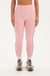 Woman wearing pink leggings set on a white background <model-info>Bre wears a size M and is 5’7”, 25½" waist, 33” bust.</model-info>
