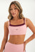 Woman wearing a pink sports bra and leggings with 'SET' branding on a white background <model-info>Bre wears a size S and is 5’7”, 25½" waist, 33” bust.</model-info>