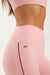 Pink athletic leggings with 'SET' branding on a white background