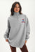 Person wearing a gray sweatshirt with a logo on a white background <model-info>Jelene wears a size M and is 5’7”, 23” waist, 32AB bust.</model-info>
