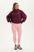 Woman wearing a burgundy jacket with 'SET' logo and pink leggings on a white background 
